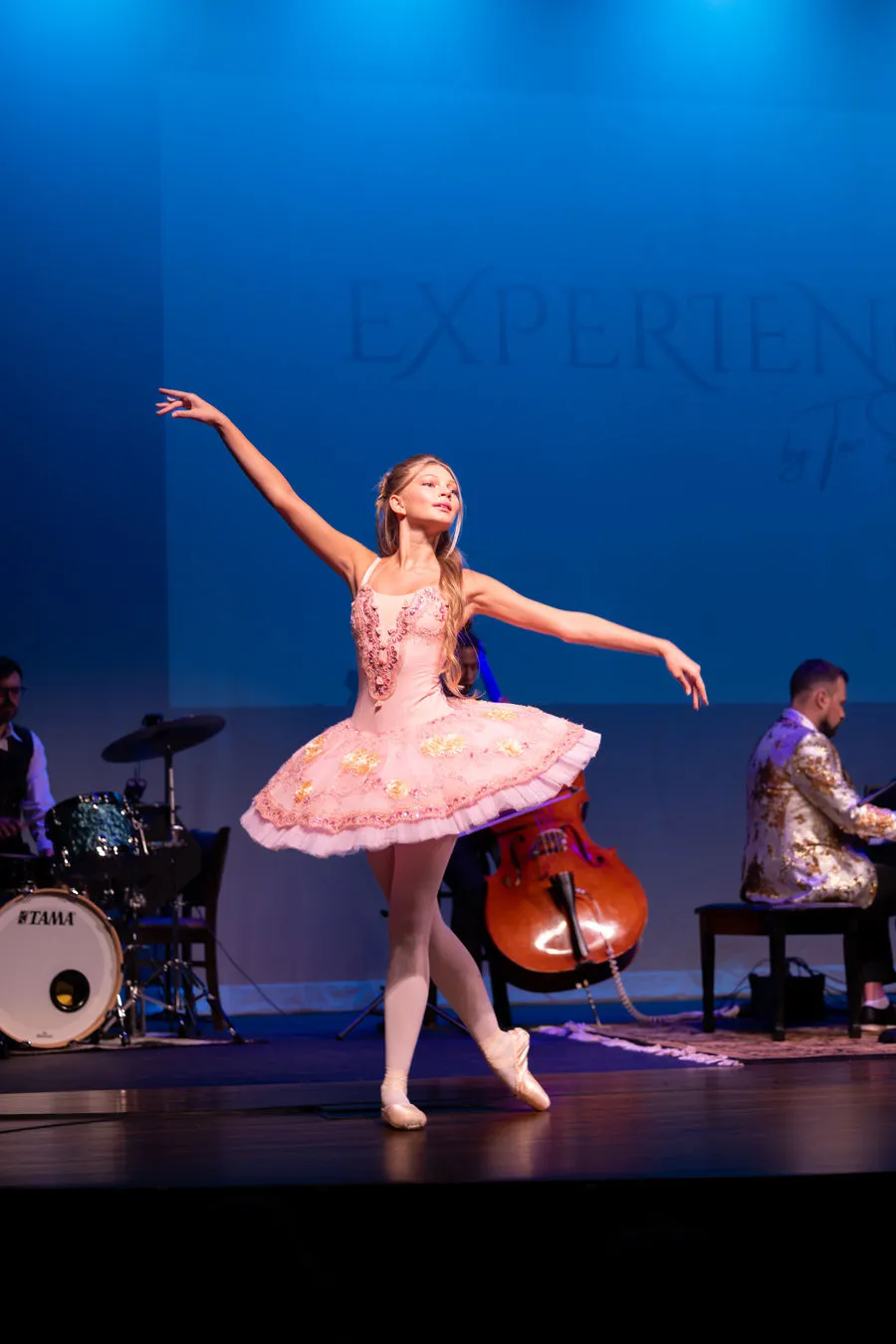 Ballerina on stage with the ensemble